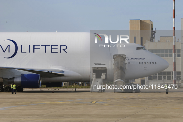 A Boeing 747 Dreamlifter (callsign: N718BA), one of the largest cargo planes in the world, is pictured during cargo operations at Taranto-Gr...