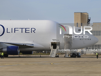 A Boeing 747 Dreamlifter (callsign: N718BA), one of the largest cargo planes in the world, is pictured during cargo operations at Taranto-Gr...