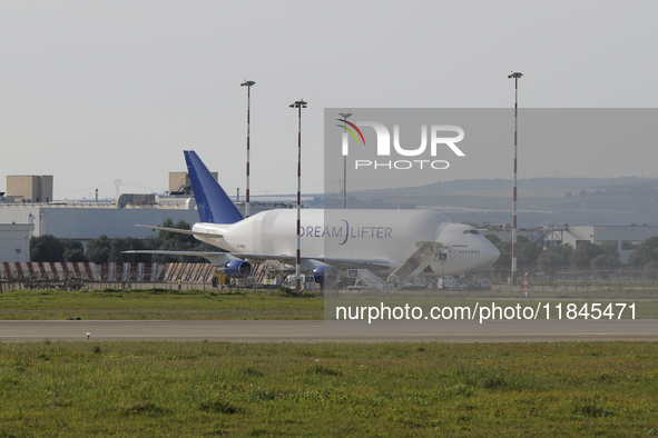 A Boeing 747 Dreamlifter (callsign: N718BA), one of the largest cargo planes in the world, is pictured during cargo operations at Taranto-Gr...