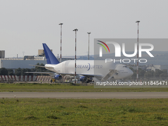 A Boeing 747 Dreamlifter (callsign: N718BA), one of the largest cargo planes in the world, is pictured during cargo operations at Taranto-Gr...