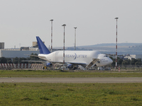 A Boeing 747 Dreamlifter (callsign: N718BA), one of the largest cargo planes in the world, is pictured during cargo operations at Taranto-Gr...