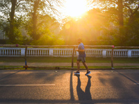 A person runs on the street on an early winter morning in Kolkata, India, on December 8, 2024. (