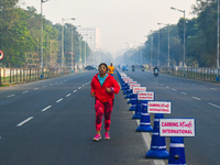 People run on the street on an early winter morning in Kolkata, India, on December 8, 2024. (