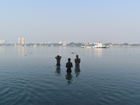 People bathe in the river Ganges on an early winter morning in Kolkata, India, on December 8, 2024. (