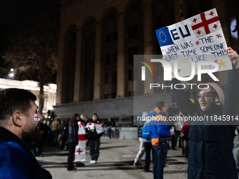 Anti-government protesters rally outside the parliament during a tenth consecutive day of mass demonstrations against the government's postp...