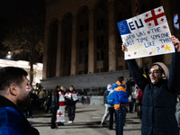 Anti-government protesters rally outside the parliament during a tenth consecutive day of mass demonstrations against the government's postp...