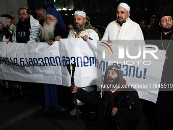 Religious leaders from different denominations demonstrate during a tenth consecutive day of mass demonstrations against the government's po...