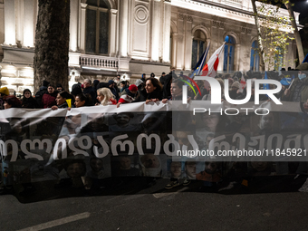 Anti-government protesters stage a march in support of detained fellow activists during a tenth consecutive day of mass demonstrations again...