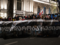 Anti-government protesters stage a march in support of detained fellow activists during a tenth consecutive day of mass demonstrations again...