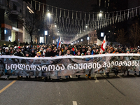 Anti-government protesters stage a march in support of detained fellow activists during a tenth consecutive day of mass demonstrations again...