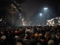 Anti-government protesters carry EU and Georgian flags as they rally for a tenth consecutive day of mass demonstrations against the governme...