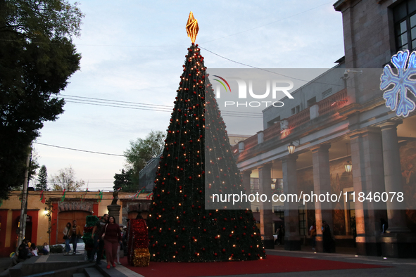 A large, illuminated Christmas tree stands on the esplanade of the Tlalpan City Hall for the December holidays in the Center of Tlalpan, in...