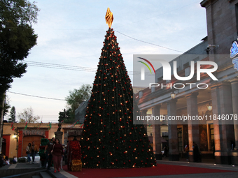 A large, illuminated Christmas tree stands on the esplanade of the Tlalpan City Hall for the December holidays in the Center of Tlalpan, in...