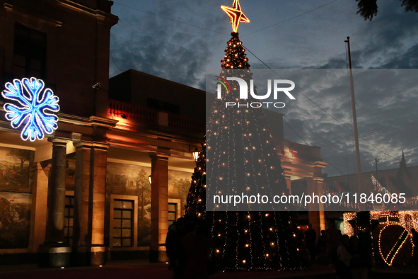 A large, illuminated Christmas tree stands on the esplanade of the Tlalpan City Hall for the December holidays in the Center of Tlalpan, in...