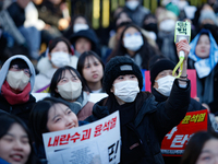 Tens of thousands of citizens gather across from the National Assembly in Yeouido, Seoul, South Korea, on December 8, 2024, holding signs th...