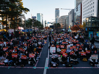 Tens of thousands of citizens gather across from the National Assembly in Yeouido, Seoul, South Korea, on December 8, 2024, holding signs th...