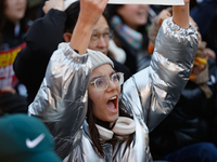 A student protests in Yeouido, Seoul, South Korea, on December 8, 2024, across from the National Assembly, holding a sign that reads, ''Pres...