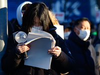 A student participates in a protest in Seoul, South Korea, on December 8, 2024, across from the National Assembly, studying for next week's...