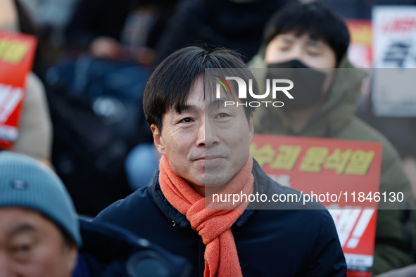 Han Chang-min, leader and National Assembly member of the Social Democratic Party, joins a candlelight protest in Seoul, South Korea, on Dec...