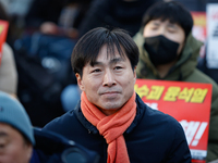 Han Chang-min, leader and National Assembly member of the Social Democratic Party, joins a candlelight protest in Seoul, South Korea, on Dec...