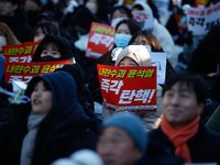 Thousands of citizens gather across from the National Assembly in Yeouido, in Seoul, South Korea, on December 8, 2024, holding signs that re...