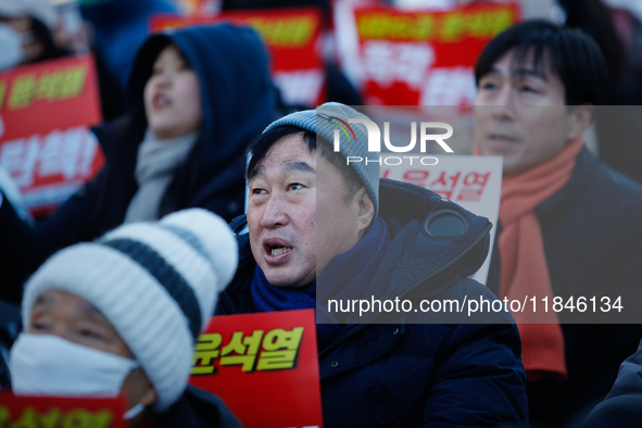 Kim Jun-hyuk, a National Assembly member from the Democratic Party of Korea, participates in a candlelight protest in Yeouido, Seoul, South...