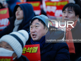 Kim Jun-hyuk, a National Assembly member from the Democratic Party of Korea, participates in a candlelight protest in Yeouido, Seoul, South...