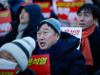 Kim Jun-hyuk, a National Assembly member from the Democratic Party of Korea, participates in a candlelight protest in Yeouido, Seoul, South...