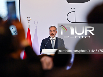 Turkish Foreign Minister Hakan Fidan talks during a press conference held on the sidelines of the Doha Forum 2024 at Sheraton Grand Doha Res...