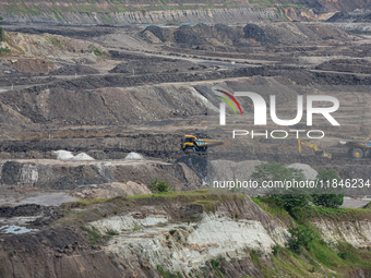 A coal mining truck operates on a haul road at an opencast coalmine in Kalimantan, Indonesia, on December 8, 2024. Environmental activists e...