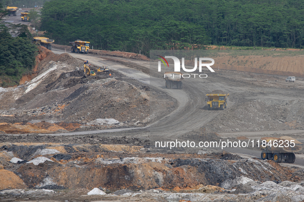 A coal mining truck operates on a haul road at an opencast coalmine in Kalimantan, Indonesia, on December 8, 2024. Environmental activists e...