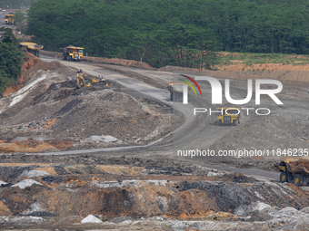 A coal mining truck operates on a haul road at an opencast coalmine in Kalimantan, Indonesia, on December 8, 2024. Environmental activists e...