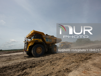 A coal mining truck operates on a haul road at an opencast coalmine in Kalimantan, Indonesia, on December 8, 2024. Environmental activists e...