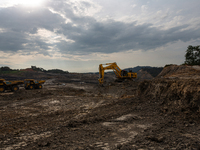 Heavy machinery operates at a coal mining site in South Kalimantan, Indonesia, on December 8, 2024. Environmental activists express concern...