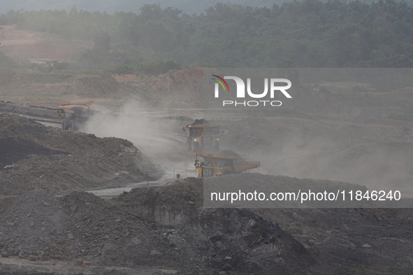 A coal mining truck operates on a haul road at an opencast coalmine in Kalimantan, Indonesia, on December 8, 2024. Environmental activists e...