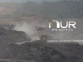 A coal mining truck operates on a haul road at an opencast coalmine in Kalimantan, Indonesia, on December 8, 2024. Environmental activists e...