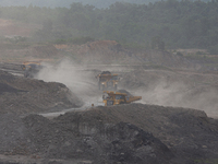 A coal mining truck operates on a haul road at an opencast coalmine in Kalimantan, Indonesia, on December 8, 2024. Environmental activists e...