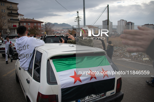 Syrian refugees living in the Onder district of Ankara, Turkey, celebrate the fall of Syrian President Bashar al-Assad after a rapid rebel o...