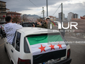 Syrian refugees living in the Onder district of Ankara, Turkey, celebrate the fall of Syrian President Bashar al-Assad after a rapid rebel o...