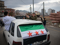 Syrian refugees living in the Onder district of Ankara, Turkey, celebrate the fall of Syrian President Bashar al-Assad after a rapid rebel o...