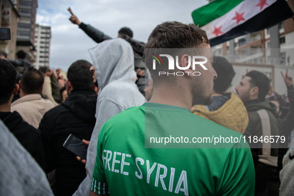 Syrian refugees living in the Onder district of Ankara, Turkey, celebrate the fall of Syrian President Bashar al-Assad after a rapid rebel o...