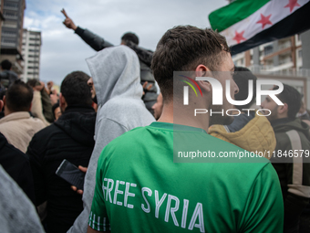 Syrian refugees living in the Onder district of Ankara, Turkey, celebrate the fall of Syrian President Bashar al-Assad after a rapid rebel o...