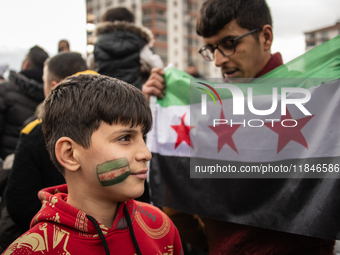 Syrian refugees living in the Onder district of Ankara, Turkey, celebrate the fall of Syrian President Bashar al-Assad after a rapid rebel o...