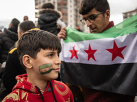 Syrian refugees living in the Onder district of Ankara, Turkey, celebrate the fall of Syrian President Bashar al-Assad after a rapid rebel o...