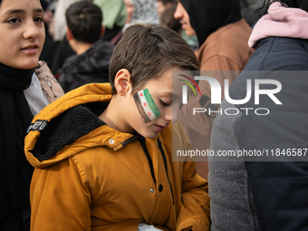 Syrian refugees living in the Onder district of Ankara, Turkey, celebrate the fall of Syrian President Bashar al-Assad after a rapid rebel o...