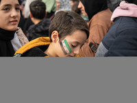 Syrian refugees living in the Onder district of Ankara, Turkey, celebrate the fall of Syrian President Bashar al-Assad after a rapid rebel o...