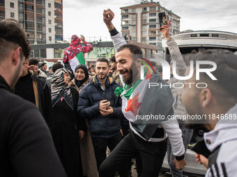 Syrian refugees living in the Onder district of Ankara, Turkey, celebrate the fall of Syrian President Bashar al-Assad after a rapid rebel o...