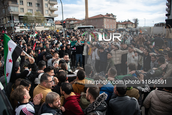 Syrian refugees living in the Onder district of Ankara, Turkey, celebrate the fall of Syrian President Bashar al-Assad after a rapid rebel o...