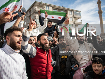 Syrian refugees living in the Onder district of Ankara, Turkey, celebrate the fall of Syrian President Bashar al-Assad after a rapid rebel o...