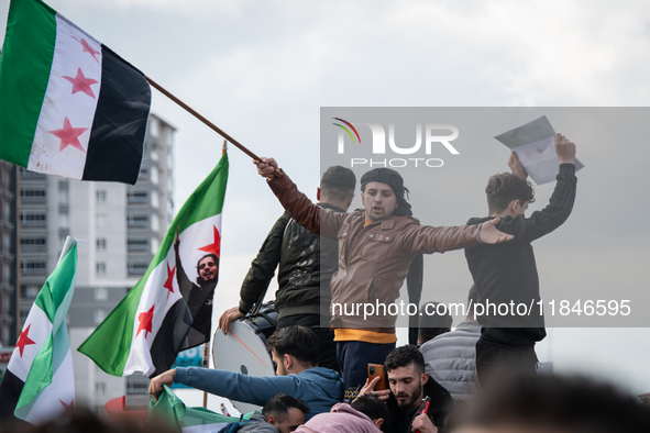 Syrian refugees living in the Onder district of Ankara, Turkey, celebrate the fall of Syrian President Bashar al-Assad after a rapid rebel o...